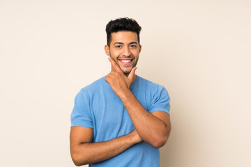 Young handsome man over isolated background smiling