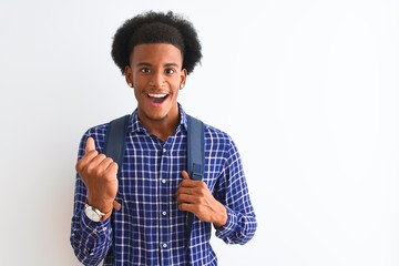 African american tourist man wearing backpack standing over isolated white background screaming proud and celebrating victory and success very excited, cheering emotion