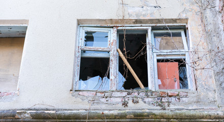 Old abandoned building with broken windows