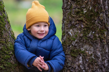 Portrait of a child outdoors. Happy little boy