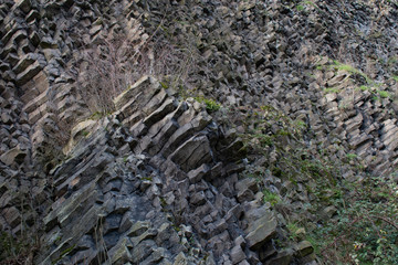 wall of stones. Nature background. Soft focus of geological structure, geological structure, basalt...
