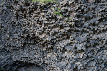 wall of stones. Nature background. Soft focus of geological structure, geological structure, basalt...