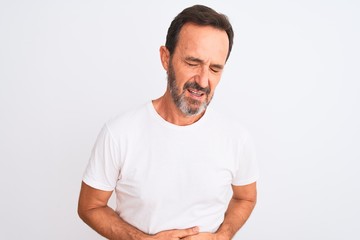 Fototapeta premium Middle age handsome man wearing casual t-shirt standing over isolated white background with hand on stomach because indigestion, painful illness feeling unwell. Ache concept.