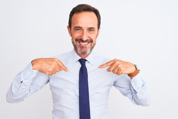 Middle age businessman wearing elegant tie standing over isolated white background looking confident with smile on face, pointing oneself with fingers proud and happy.