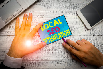 Writing note showing Local Seo Optimization. Business concept for increase Search Visibility to...