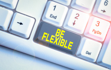 Writing note showing Be Flexible. Business concept for able to be easily modified to respond to...