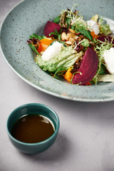 salmon salad with toast in a blue plate