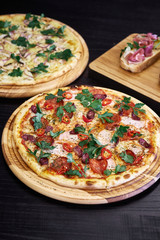 two kinds of pizza, one of which is veggie