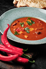 spicy Transcarpathian soup with meat and bread in a plate