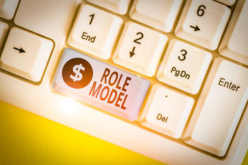 Writing note showing Role Model. Business concept for a demonstrating looked to by others as an...