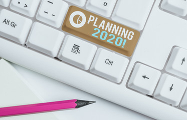 Conceptual hand writing showing Planning 2020. Concept meaning process of making plans for...