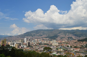 Fototapeta na wymiar topview of medellin city, colombia, with buildings and shanty towns. contrast between poor and rich