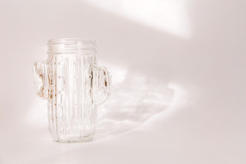 White transparent glass stands on a white background.