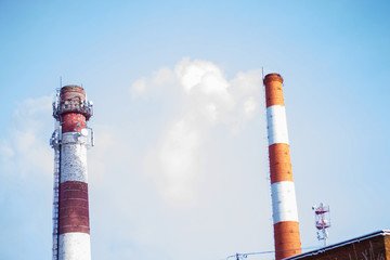 two tall towers against the blue sky