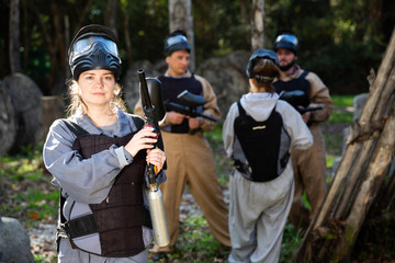 Portrait of young woman paintball player