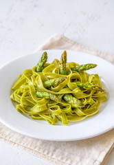 Spinach fettuccine with fried asparagus