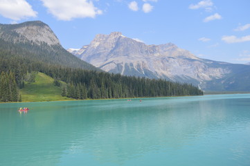  Green Lake with Calm Waves Overlooking Mountains and Forest. Green Alpine Glacier Lake in Canadian Rocky Mountains, Emerald Lake, Yoho National Park, British Columbia, Canada.