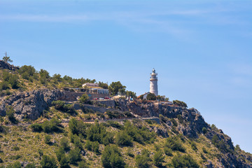 Fototapeta na wymiar Lighthouse on the hill at Port de Soller in Majorca. Spain