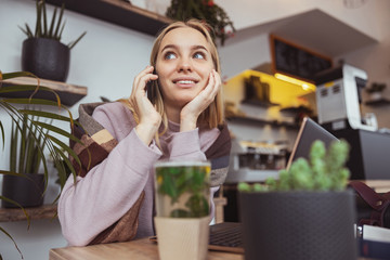 Young cheerful lady outdoors and indoors