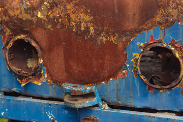 the old rusty surface of the car tram, the metal surface reduced by rusting and rusting