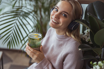 Young cheerful lady outdoors and indoors