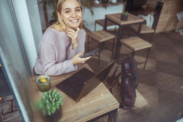 Young cheerful lady outdoors and indoors