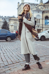 Fototapeta premium Young cheerful lady outdoors and indoors