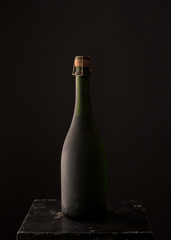 bottle of red wine on a black background