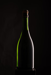 bottle of wine on black background