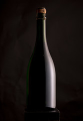 bottle of wine with a black background in contrast