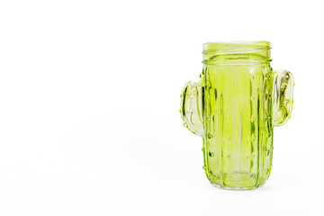 Glass green glass in the shape of a cactus on a white background