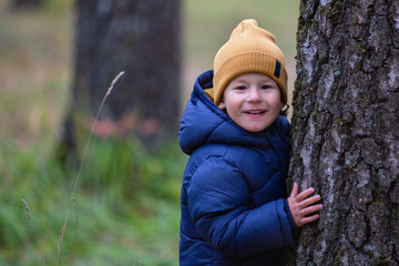 Portrait of a child outdoors. Happy little boy