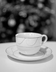 white coffee cup on a black and white photo