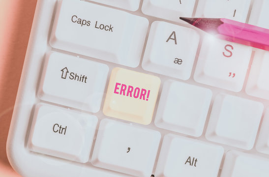 Conceptual hand writing showing Error. Concept meaning state or condition of being wrong in conduct judgement or program White pc keyboard with note paper above the white background