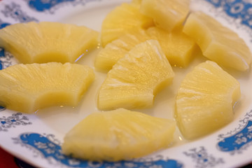 A plate with pineapple slices, healthy food