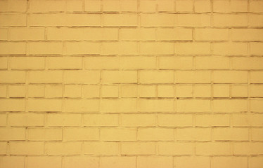  Old yellow painted brick wall. Average plan