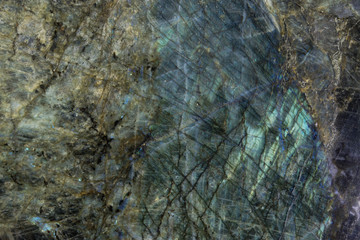 A green-blue marble slab with shiny iridescent fragments is called Big Blue or Lemurian Blue