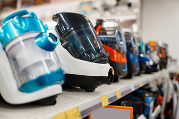 Vacuum cleaners in electronics store, nobody