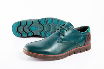 Male cyan leather shoes on white background, isolated product, top view.