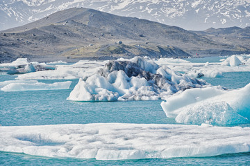 Glacier and calved ice and icebergs at the Jokulsarlon Lagoon in Iceland