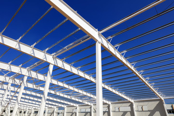 A white steel beam under the blue sky
