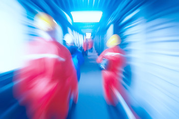 Obraz premium technological background workers in motion in the factory blurred