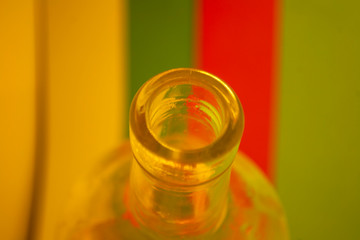 The Neck Of A Glass Bottle on multicolors backgraund