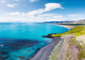 Iceland. Aerial view on the coast line, mountains and ocean. Beach and sea from air. Famous place in Iceland. Summer seascape from drone. Travel - image