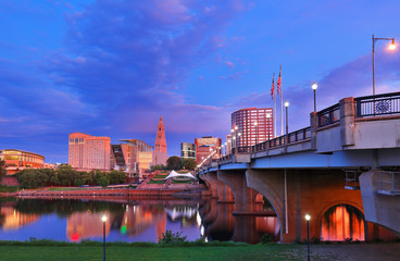 The skyline of Hartford, Connecticut before sunrise. Photo shows Founders Bridge and Connecticut River. Hartford is the capital of Connecticut. 