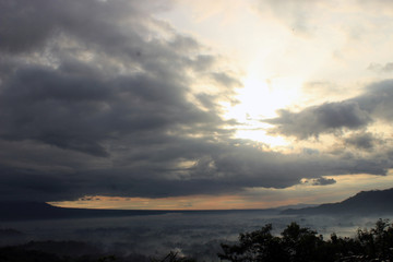 Fototapeta na wymiar Cloudy sunrise on punthuk setumbu