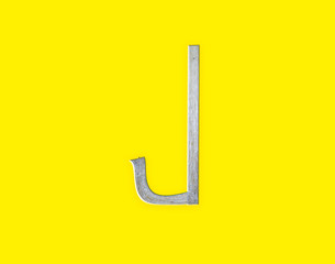 The English letter " J " consists of boards nailed down