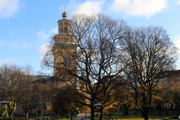 Church in Stockholm in Sweden Europe. With a blue sky on a autumn day. With trees in the front
