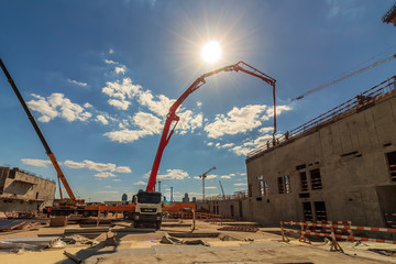concrete pump building under construction. Concrete pump on high rise building under construction...