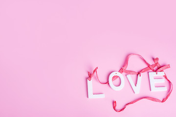 love on a pink background.Flat lay , view from above. Place for the inscription.